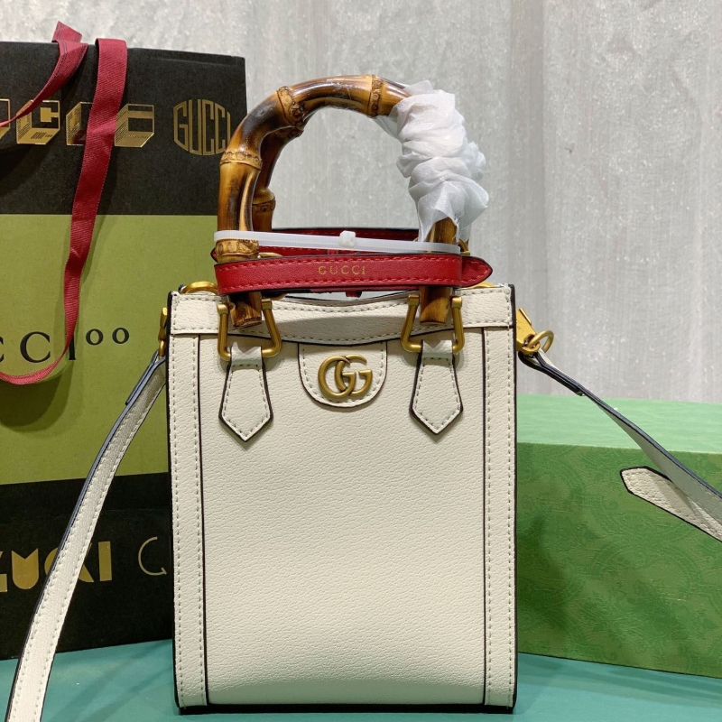 G*u*i top handle bags